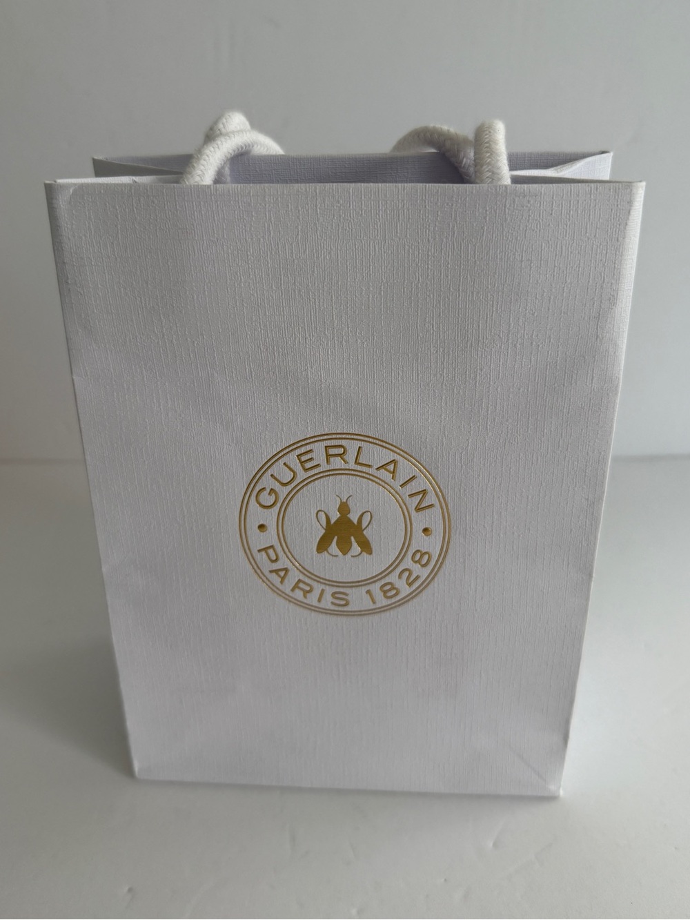 GUERLAIN White and Gold Logo Shopping Bag